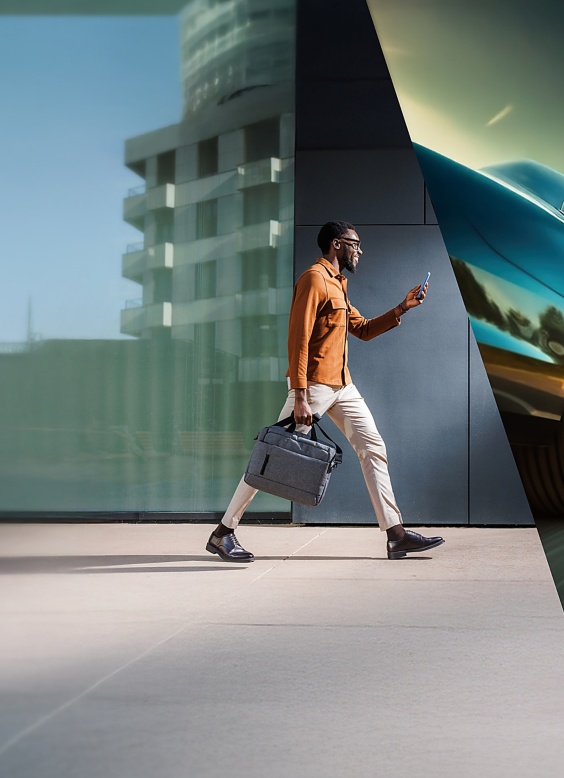 a man walking with a briefcase
