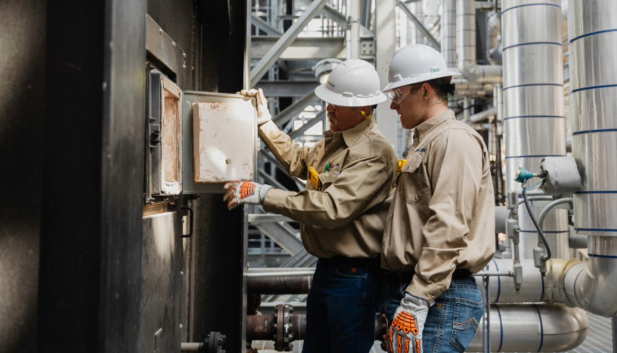 men wearing white hardhats and white helmets