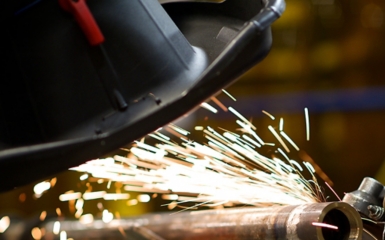 a man welding a pipe