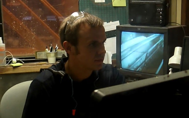 a man looking at a computer screen