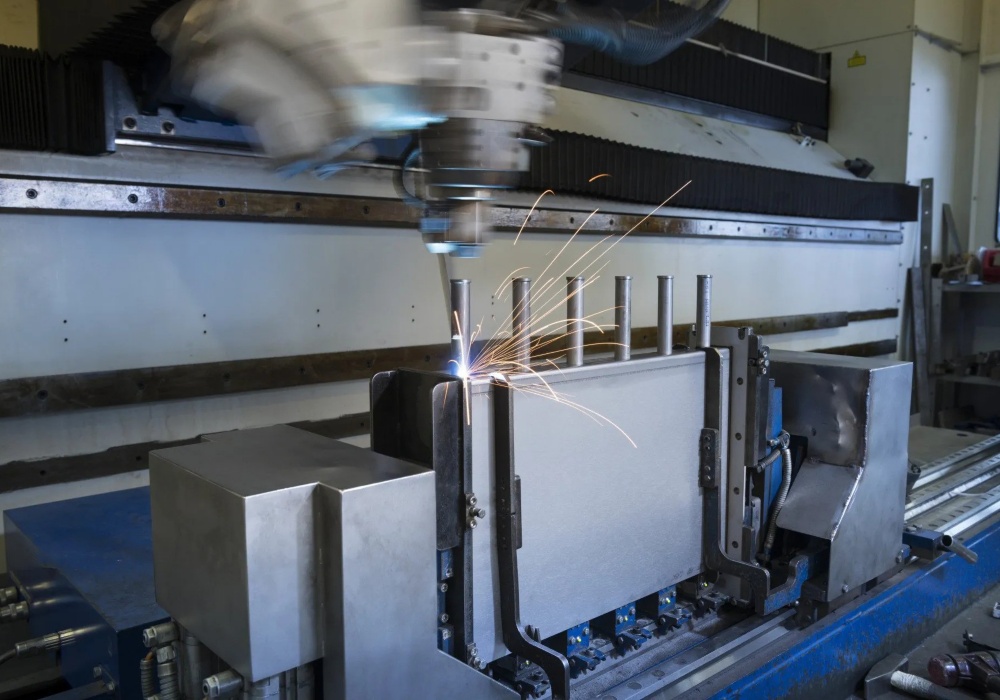 a machine cutting metal with sparks