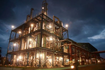 a building with many pipes and lights