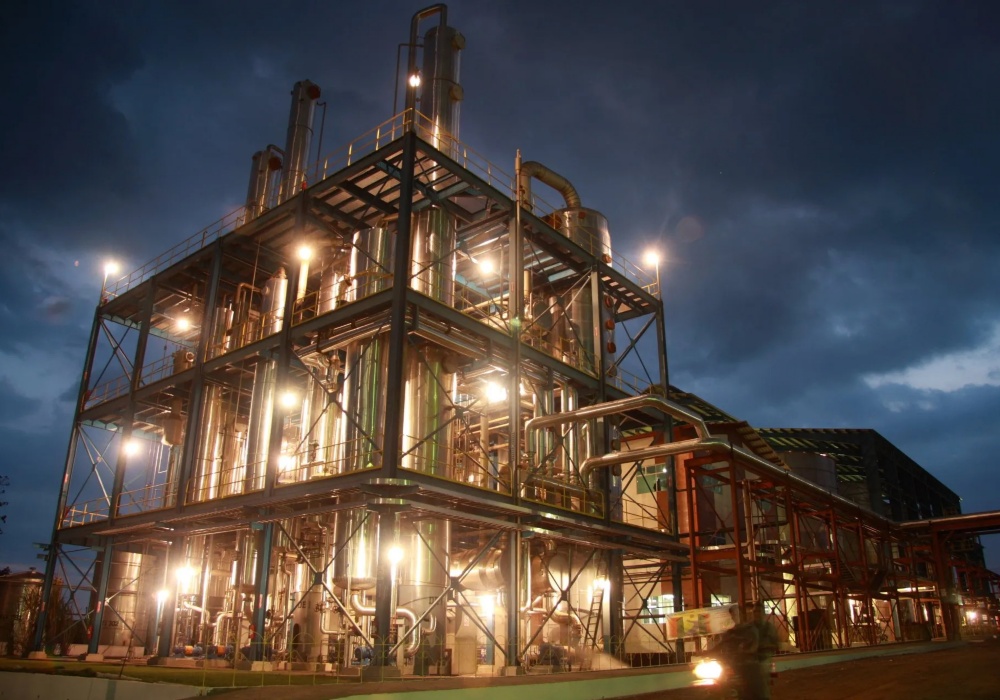 a building with many pipes and lights