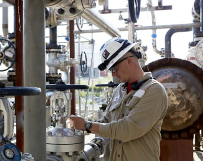 a man wearing a hard hat and white helmet