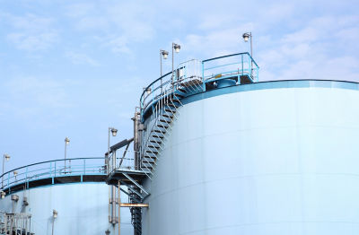 a large white silos with a staircase