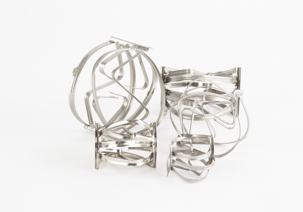 several metal objects on a white background