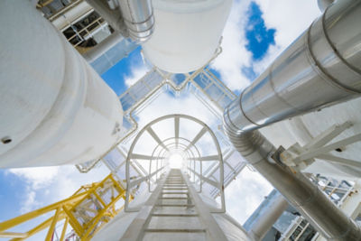 a ladder leading up to a large white tank