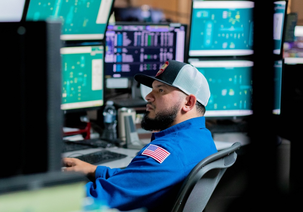 a man sitting in front of a computer