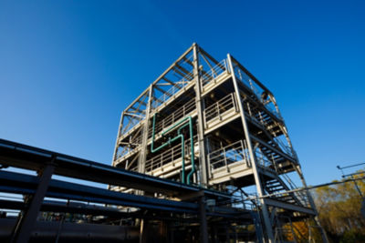 a building with pipes and blue sky