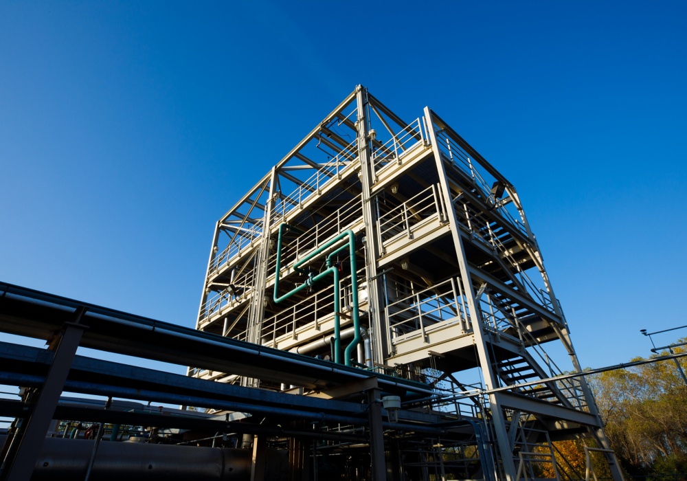 a building with pipes and blue sky