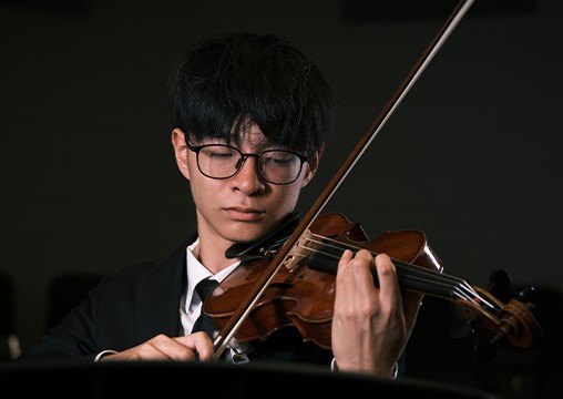 a man playing a violin