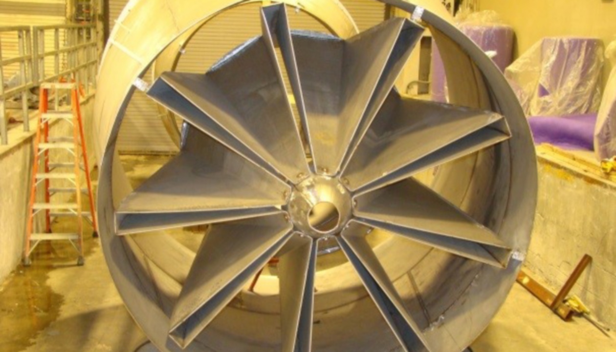 a large metal turbine in a factory