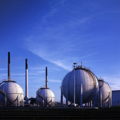 several white spherical tanks