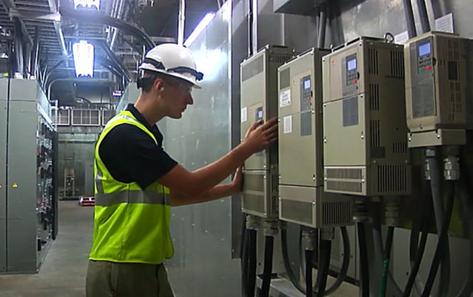 a man wearing a safety vest and hardhat