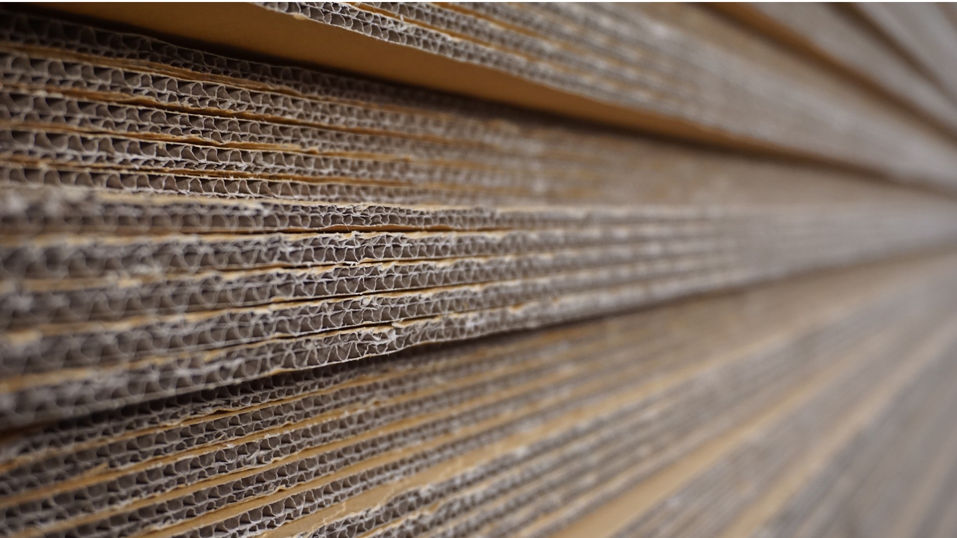 Corrugated boxes stacked together, up close. 