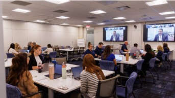 a group of people sitting at tables in a room