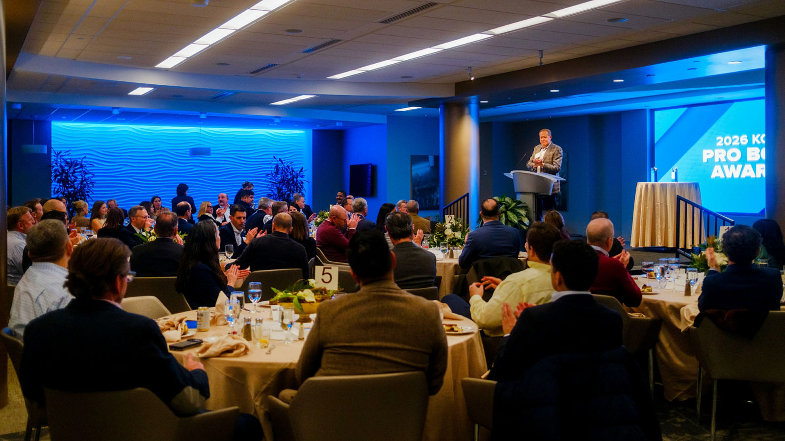 a man standing in front of a crowd of people