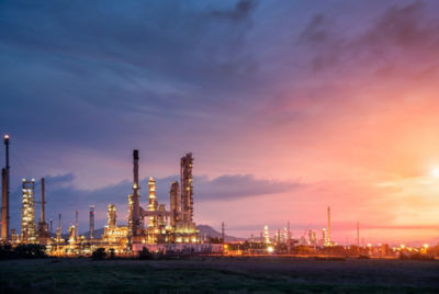 a factory with a sunset