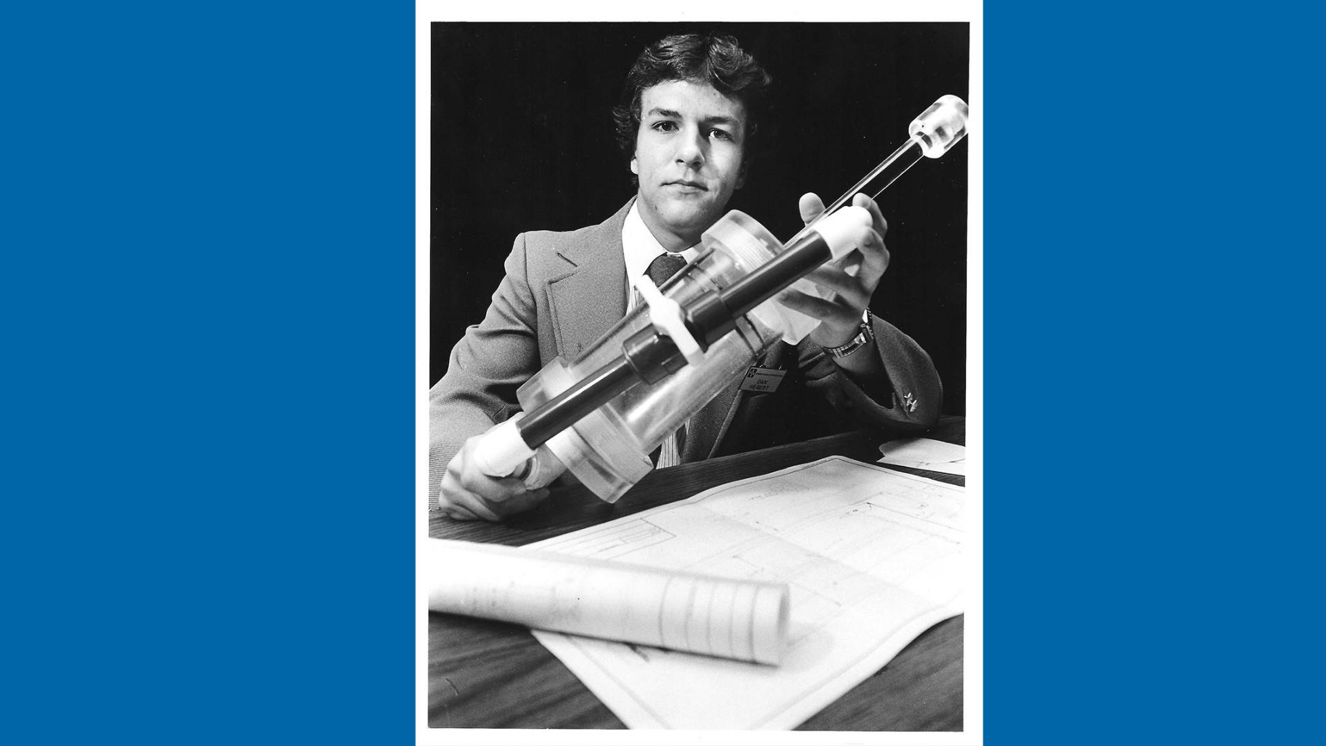 This image shows a photo of Wisconsin high school student Daniel Hebert and his prototype device designed to create paper in space. The experiment was conducted aboard the NASA Space Shuttle Columbia in 1986 by NASA astronauts.&nbsp;