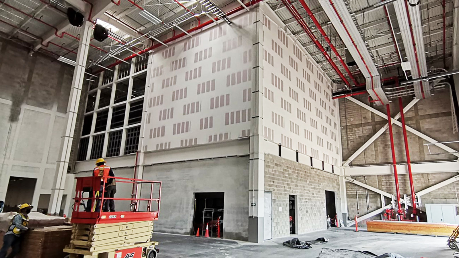 a man in a lift in a warehouse