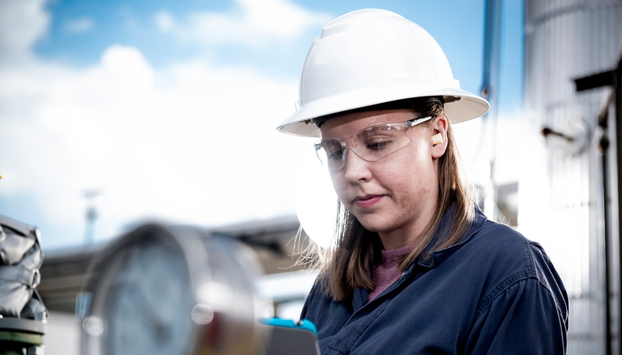 a woman in a hard hat and goggles