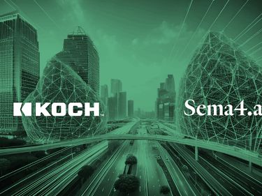 a road with buildings in the background