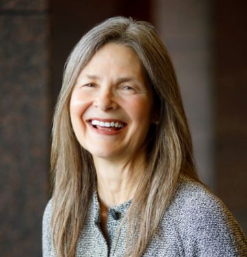 a woman smiling at the camera