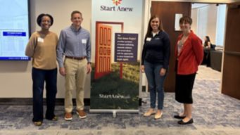 a group of people standing in a room