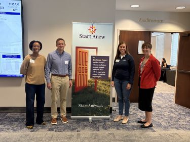 a group of people standing in a room