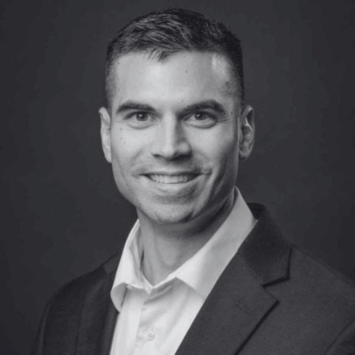 a man in a suit smiling