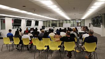 a group of people sitting in a room