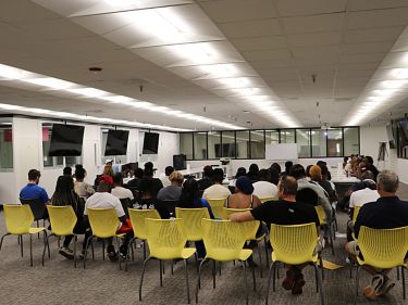 a group of people sitting in a room