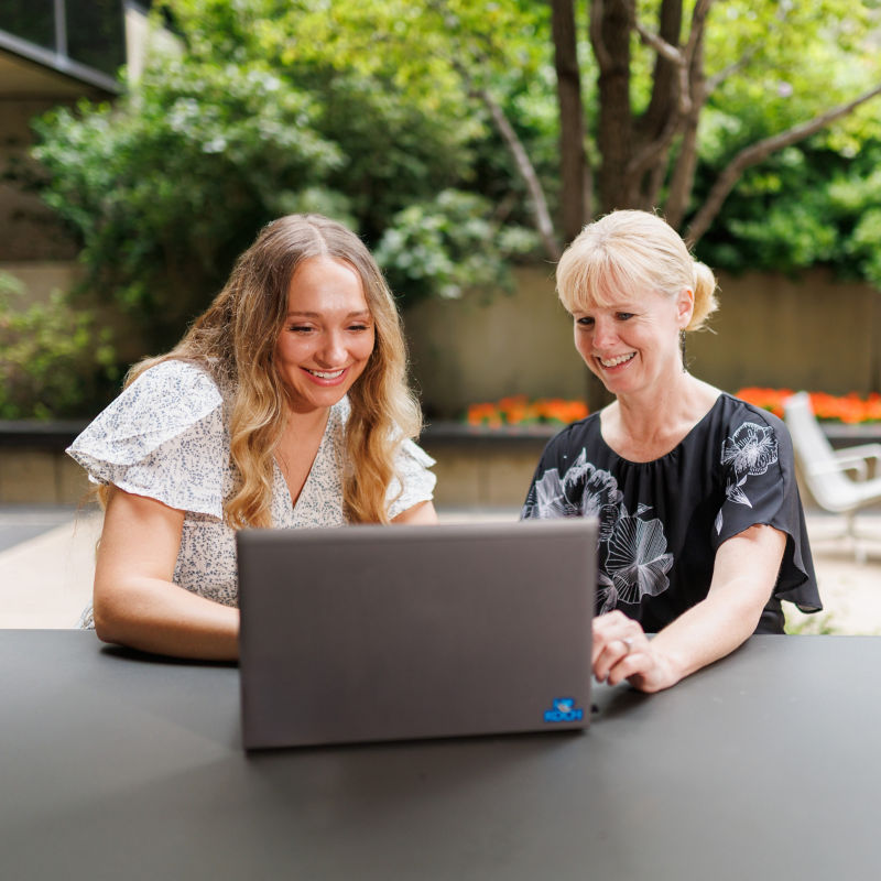 women looking at a laptop