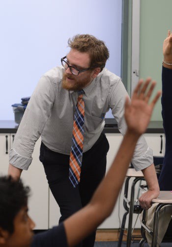 a man in a tie and glasses