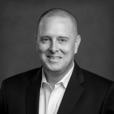 a man in a suit smiling