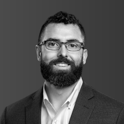 a man with a beard and glasses