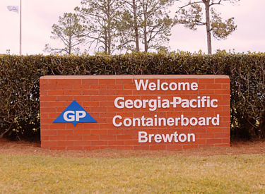 a brick sign with white text