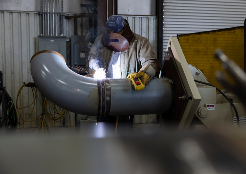 a man welding a pipe