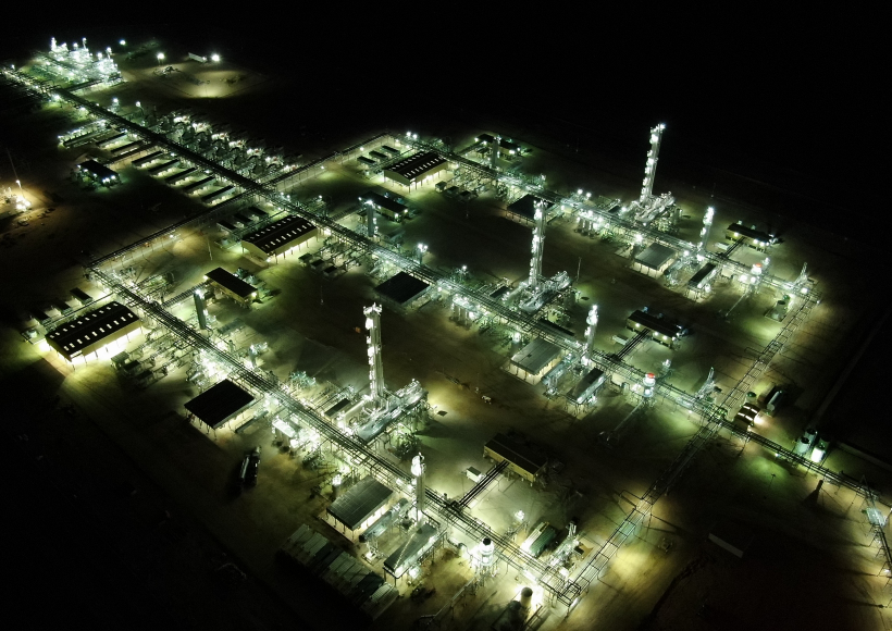 an aerial view of a factory at night