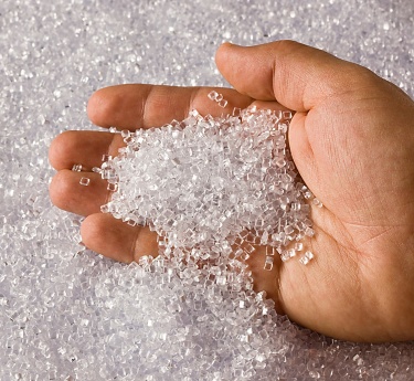 a hand holding a handful of crystals