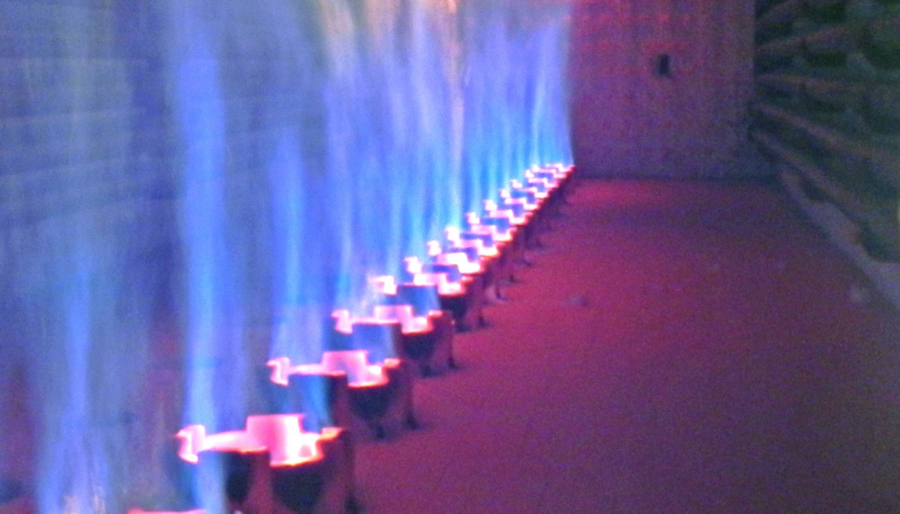 a row of lit candles in a room