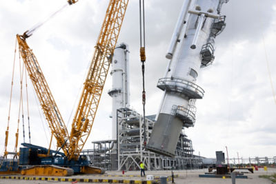 a crane lifting a large machine