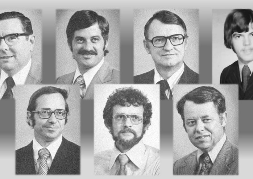 a group of men wearing suits and ties