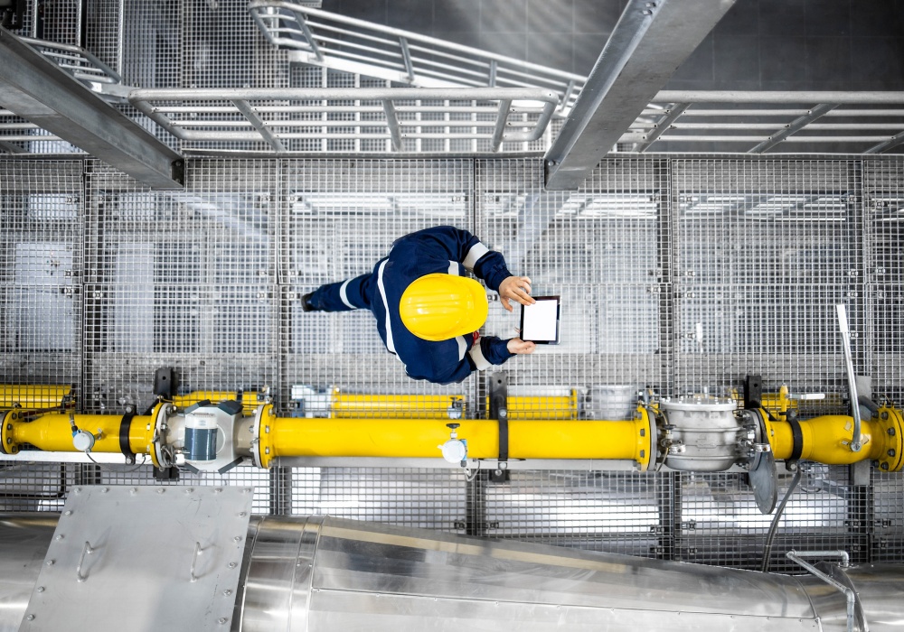 a man in a hard hat using a tablet