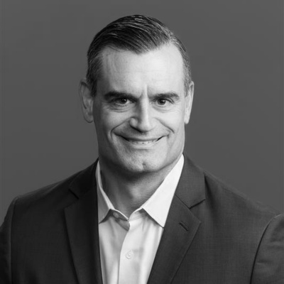 a man in a suit smiling