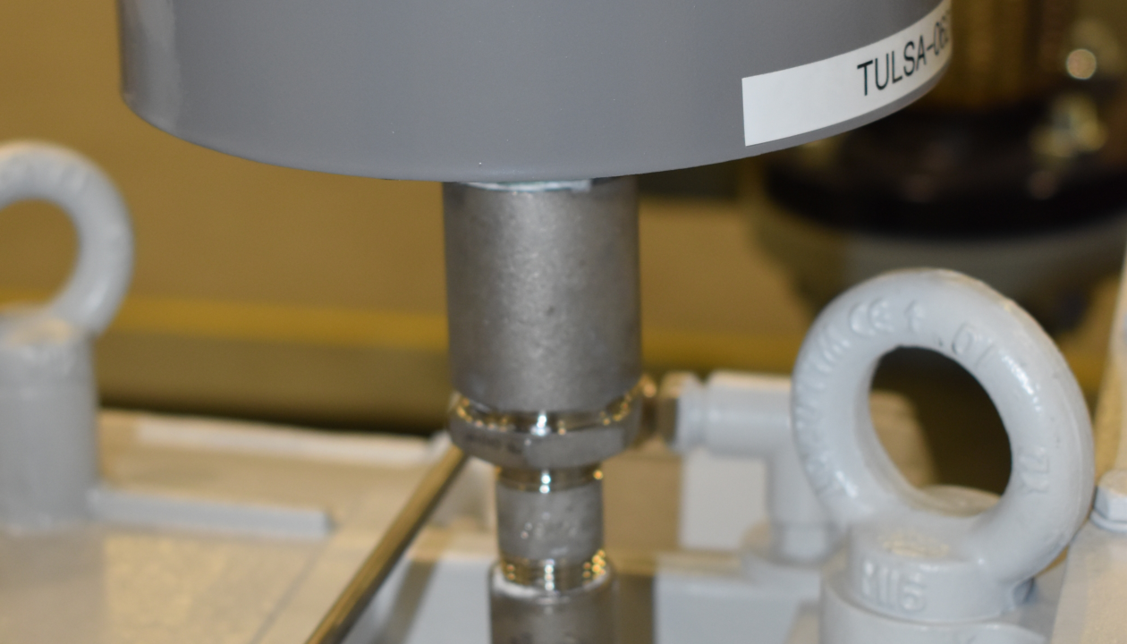 a close-up of a grey cylinder