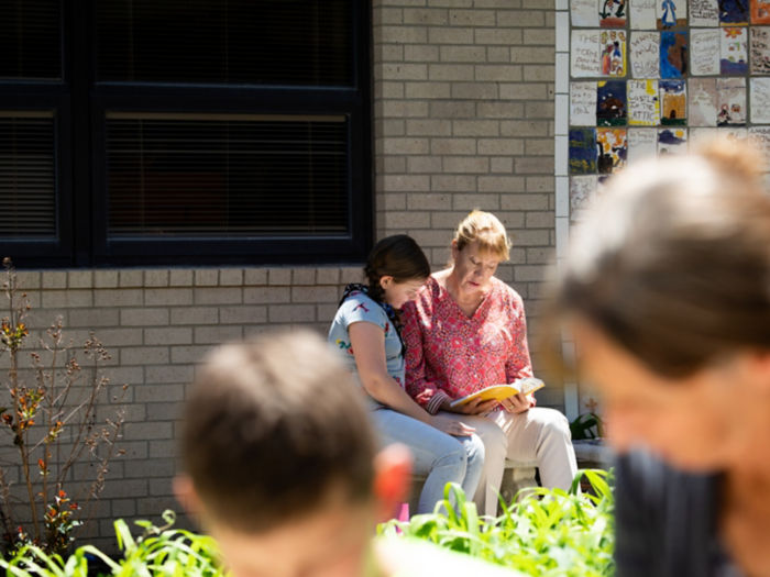 a group of people sitting outside