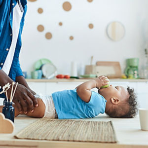 a baby lying on a table