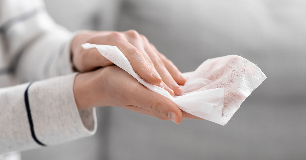 a person holding a tissue