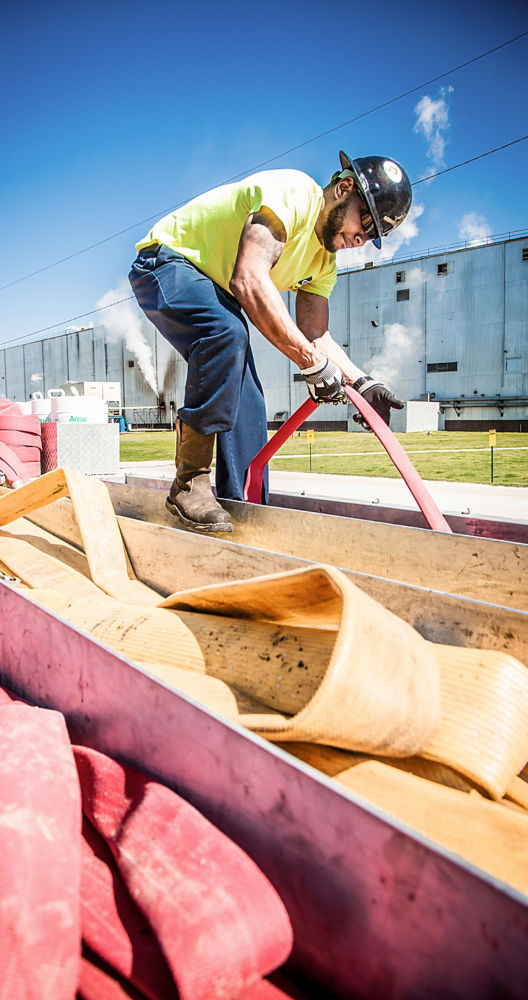 a man holding a fire hose